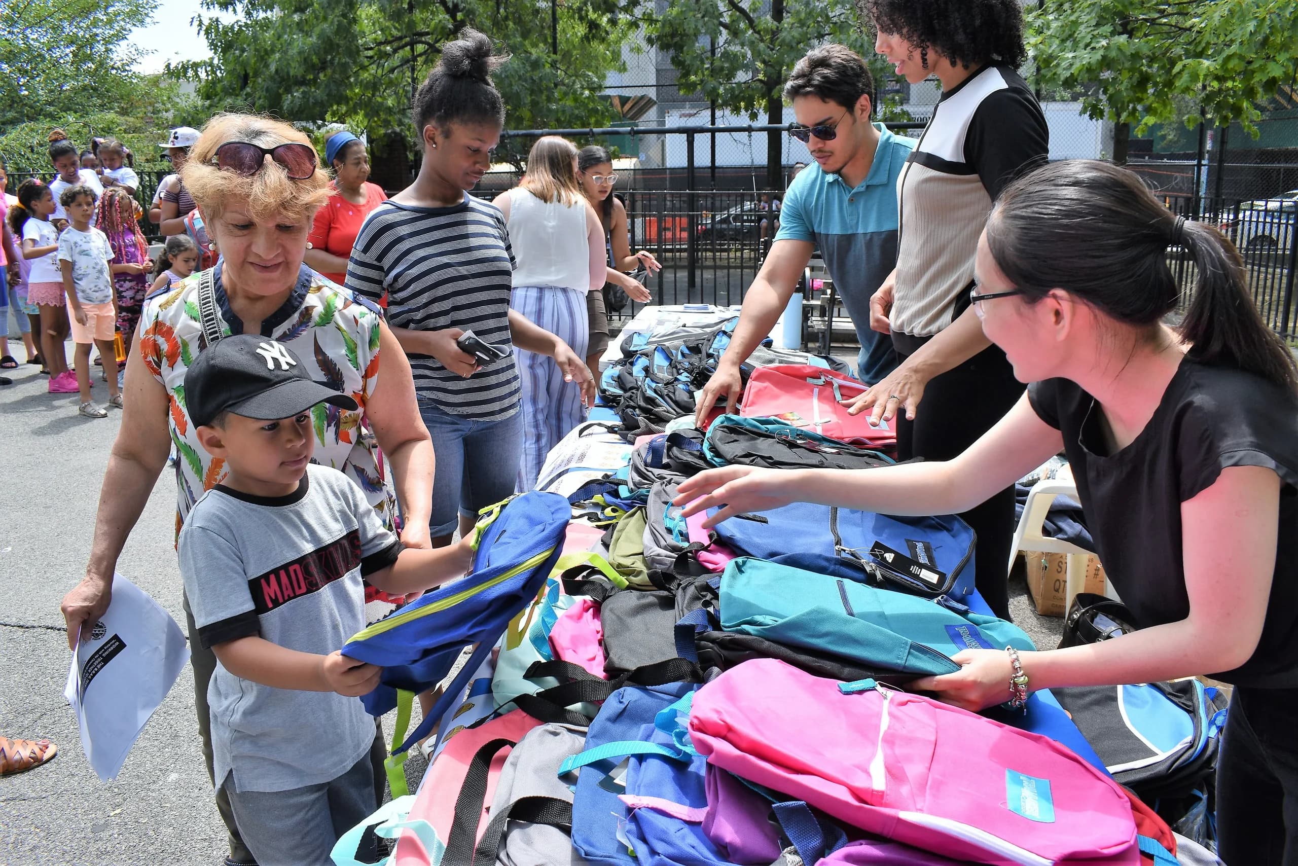 Volunteers handing out essentials to families at a Heart for the Community giveback event