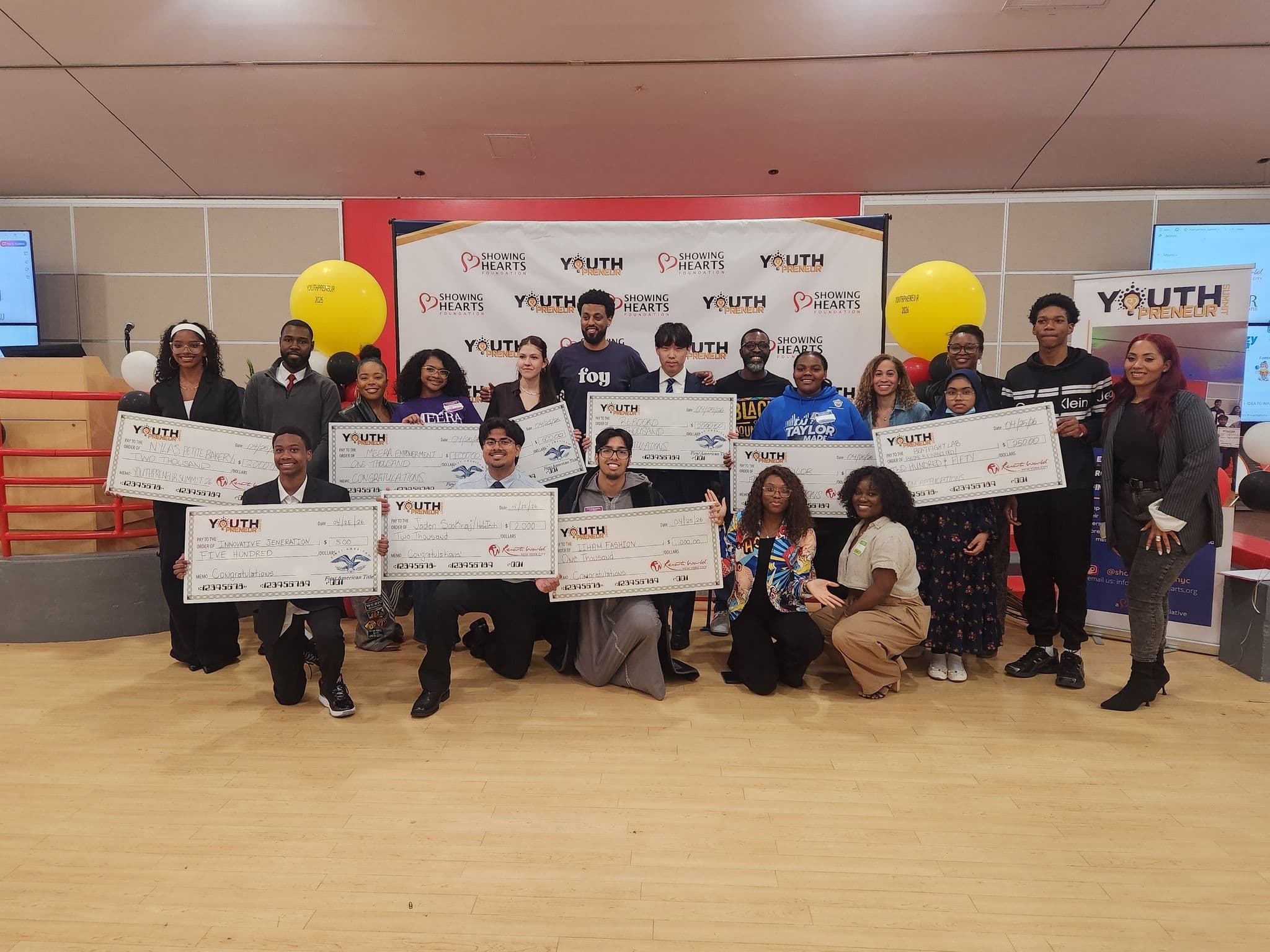 All pitch competition winners holding their checks at Youthpreneur Summit 2026
